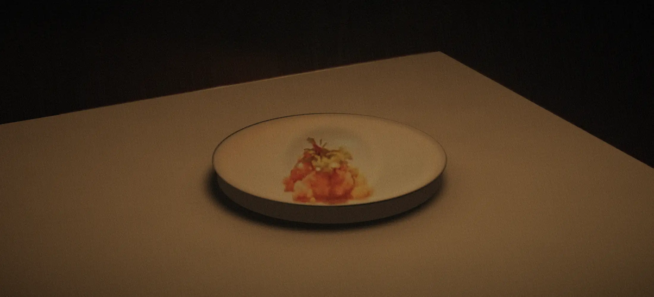The same dish shot on a phone under the room's lights: yellow, flat, dull.